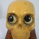 Illustration for article titled Creepily Cute Skull-Shaped Clock Rolls Its Eyes To Tell Time